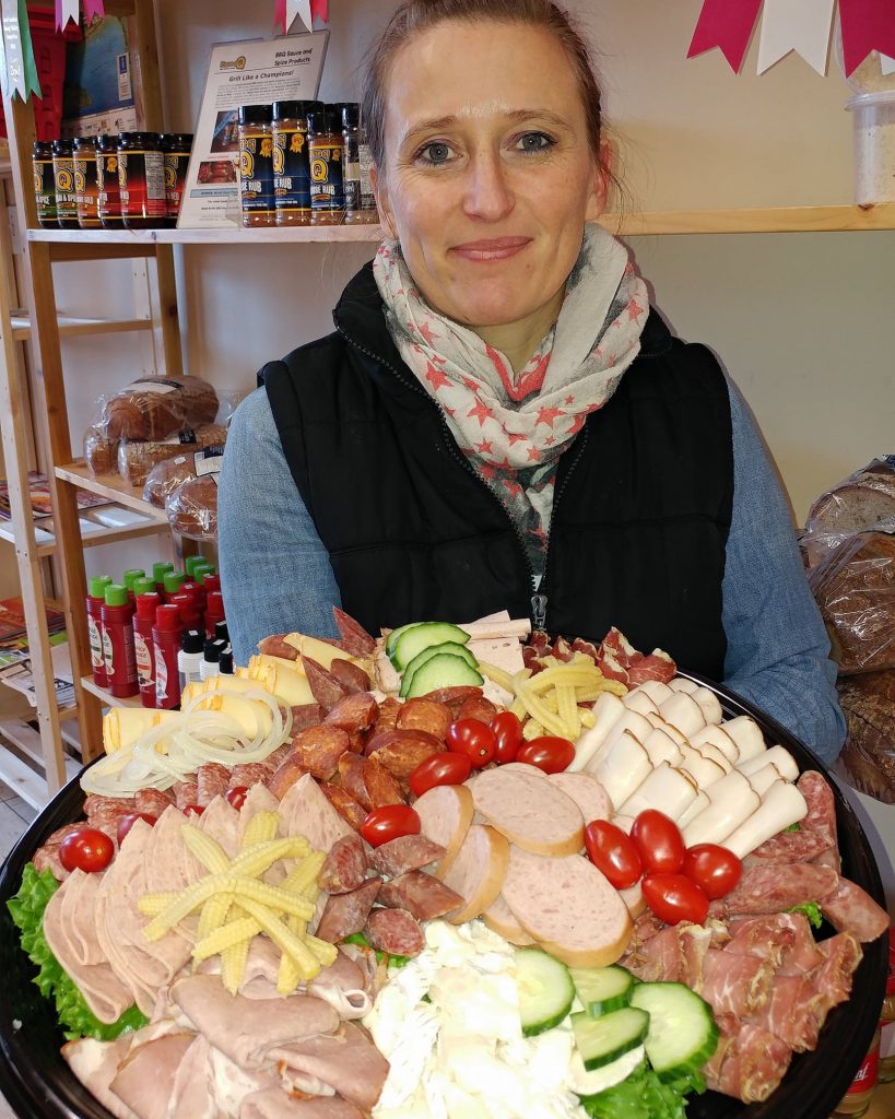 Sandra showing mixed tray she made for a customer's special event
