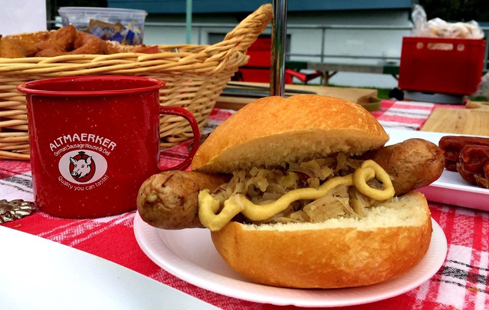 Bratwurst in a Brötchen with Senf and a Mug